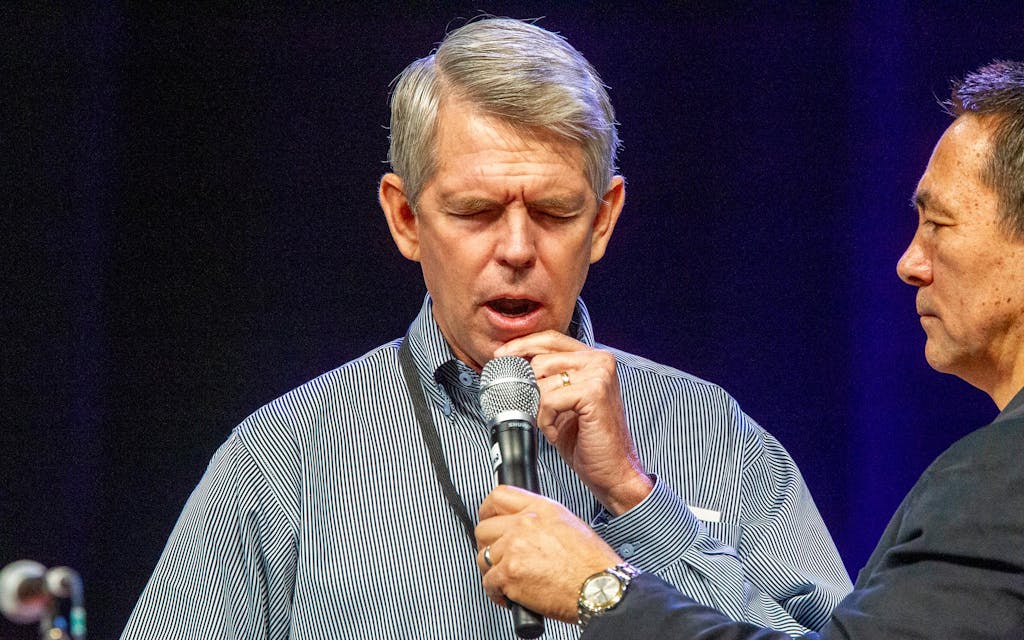 David Barton, founder of WallBuilders, prays at The Response a day-long "call to prayer" in Houston on August 6, 2011.