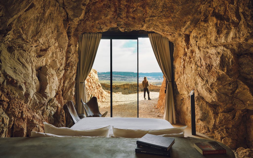 A guest enjoying the view outside one of two cave suites at the Summit at Big Bend.