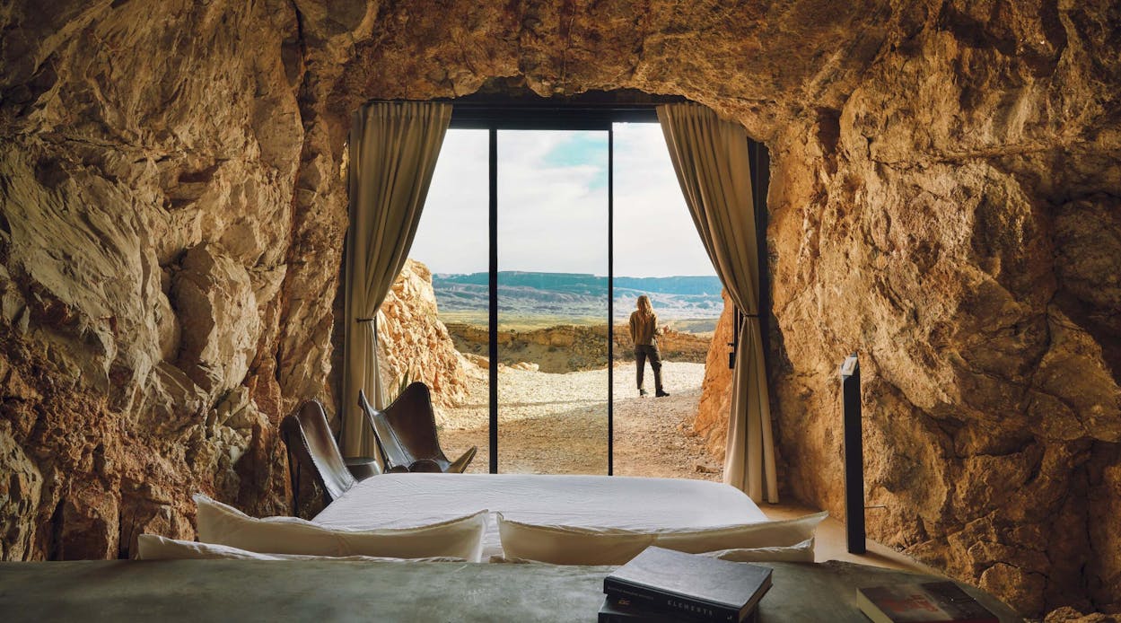 A guest enjoying the view outside one of two cave suites at the Summit at Big Bend.