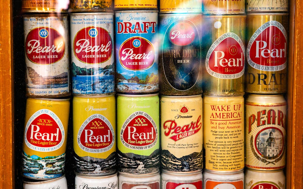 Historical Pearl Brewing lager cans on display at the 2024 Hillhops Event on January 25.