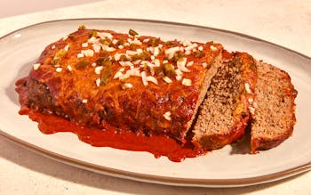 Enchilada meat loaf covered in chili sauce