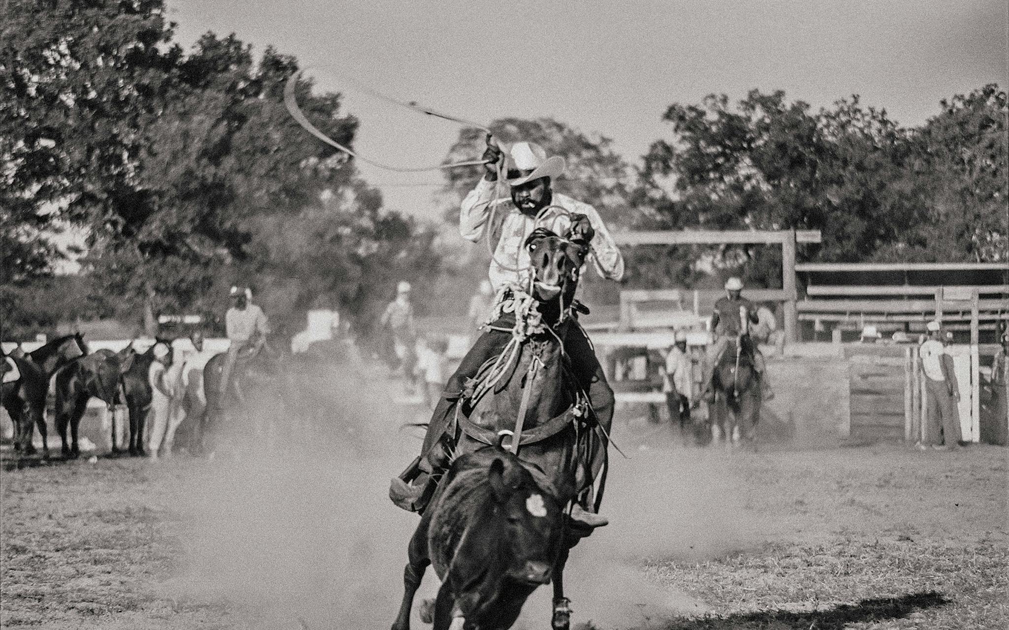 A roper chases his calf at an event near El Campo in the summer of 1978.