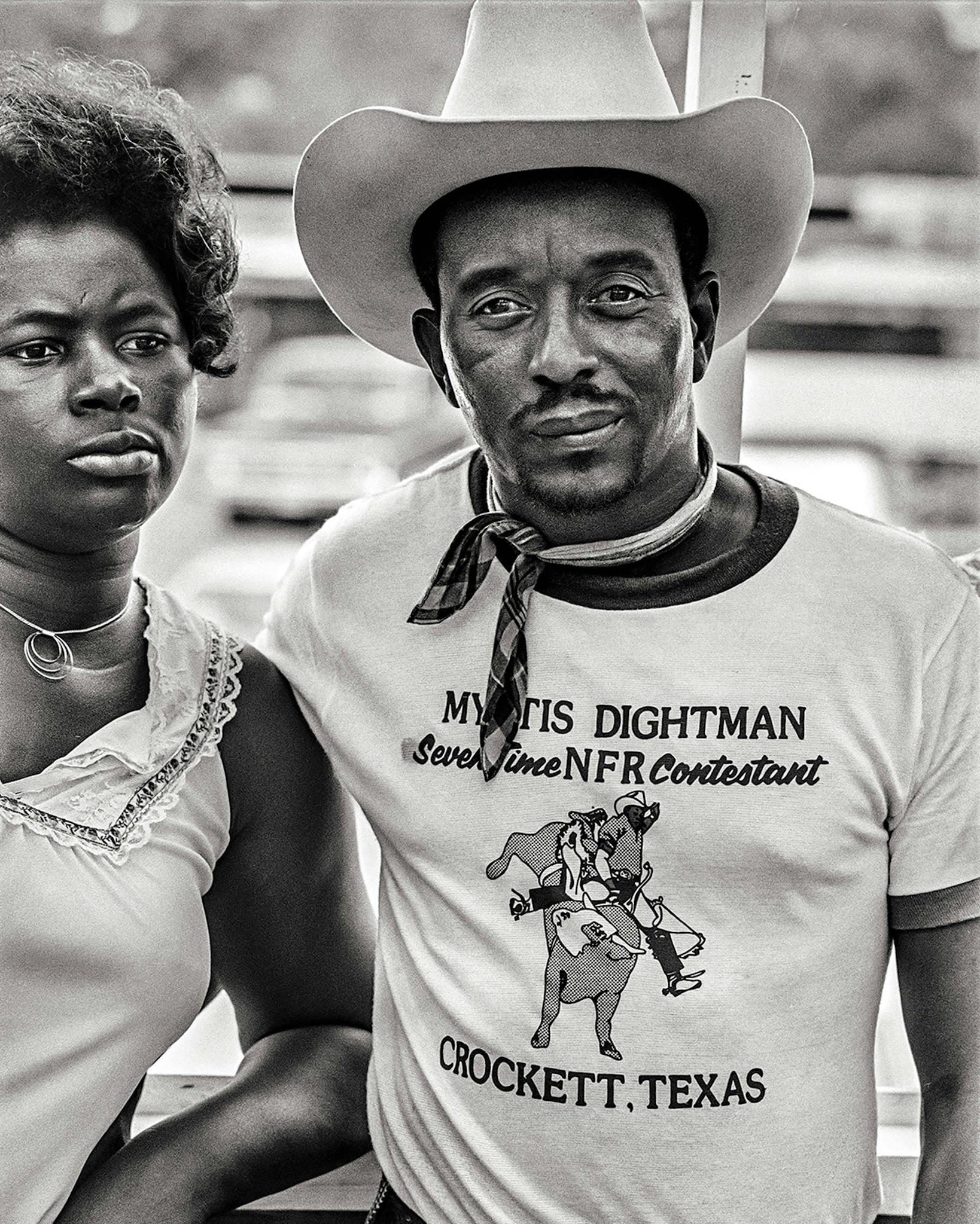 Rough-stock rider Robert Dugas, with his wife, paying T-shirt tribute to the seven-time National Finals Rodeo competitor Myrtis Dightman.
