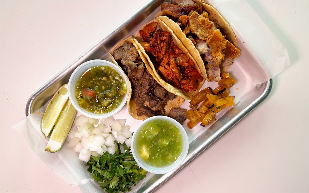 Tacos de lechon, al pastor, and ribeye carne asada.