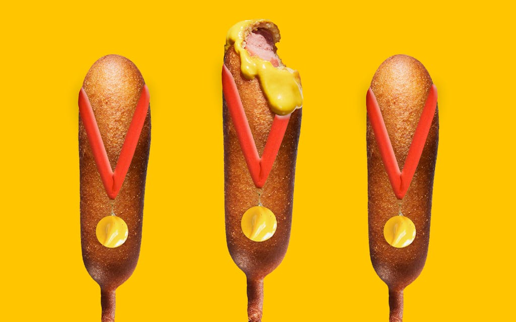 Competitive Eater corn dogs with medals