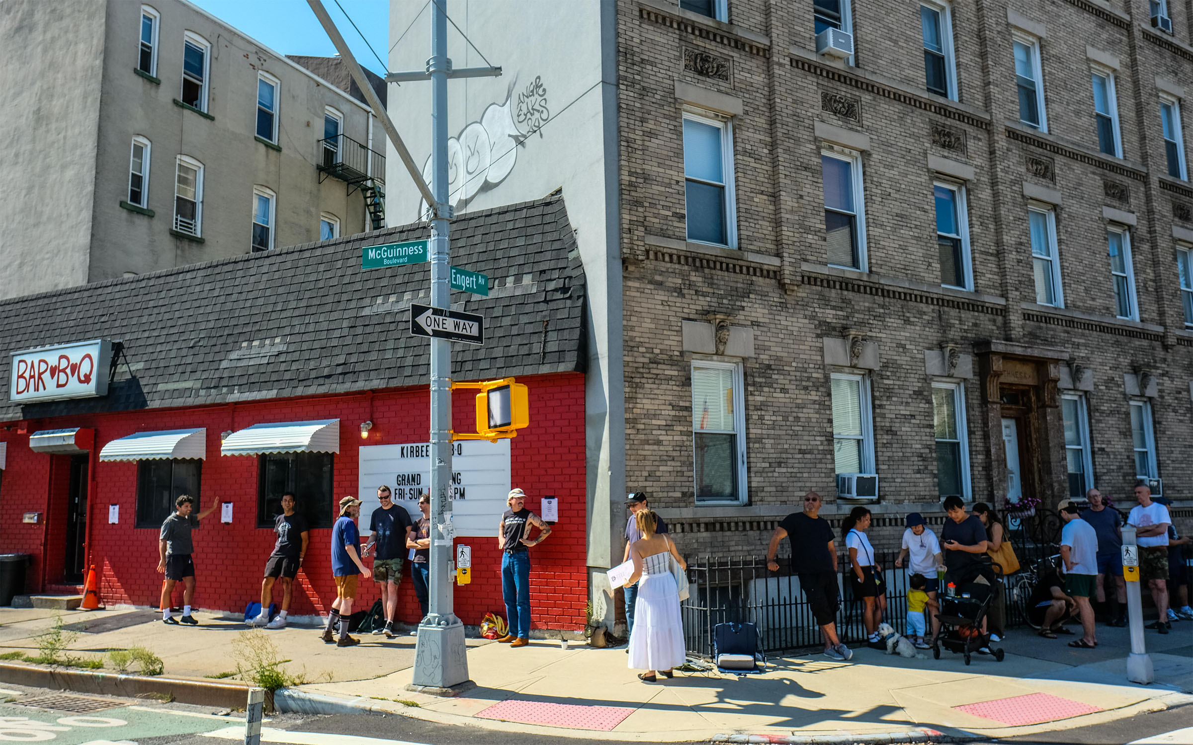 People lined up outside of a restaurant