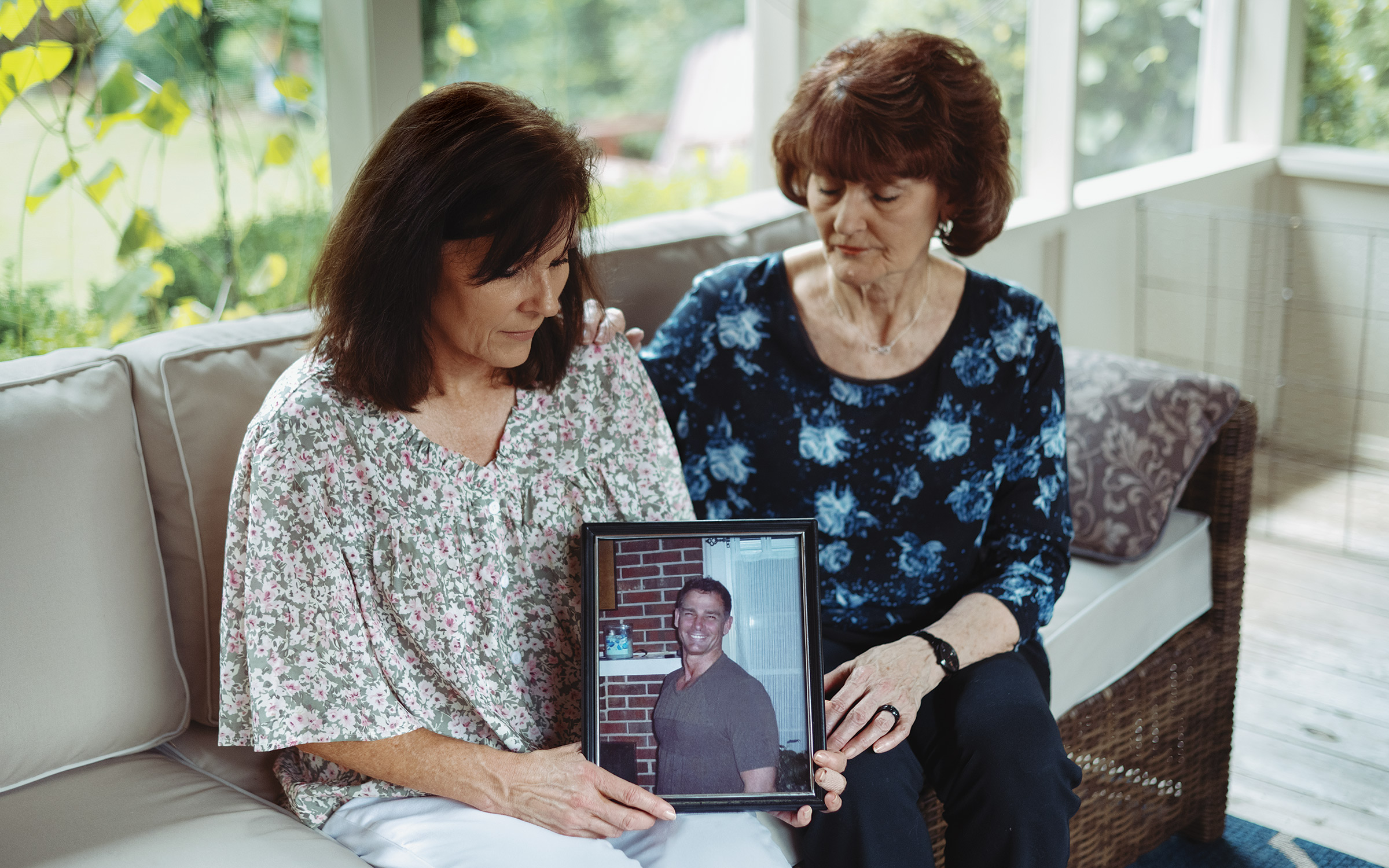 photo of two women holding photo