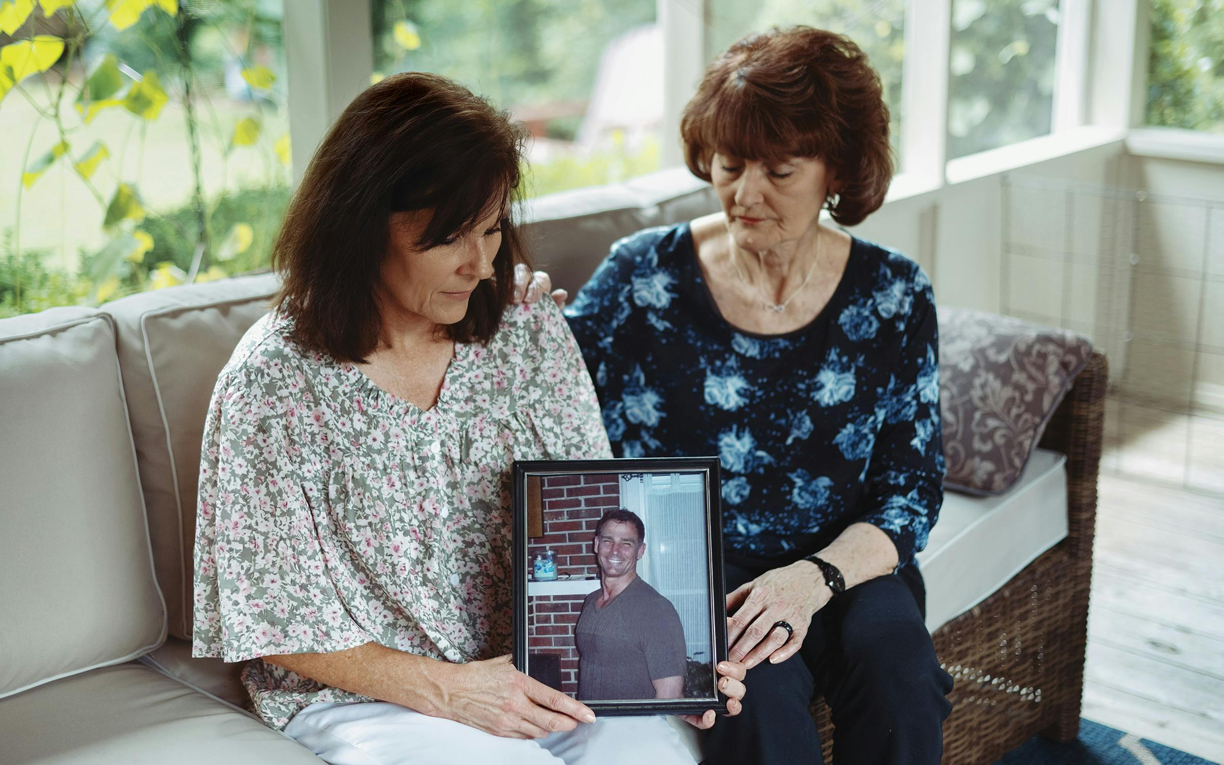 photo of two women holding photo