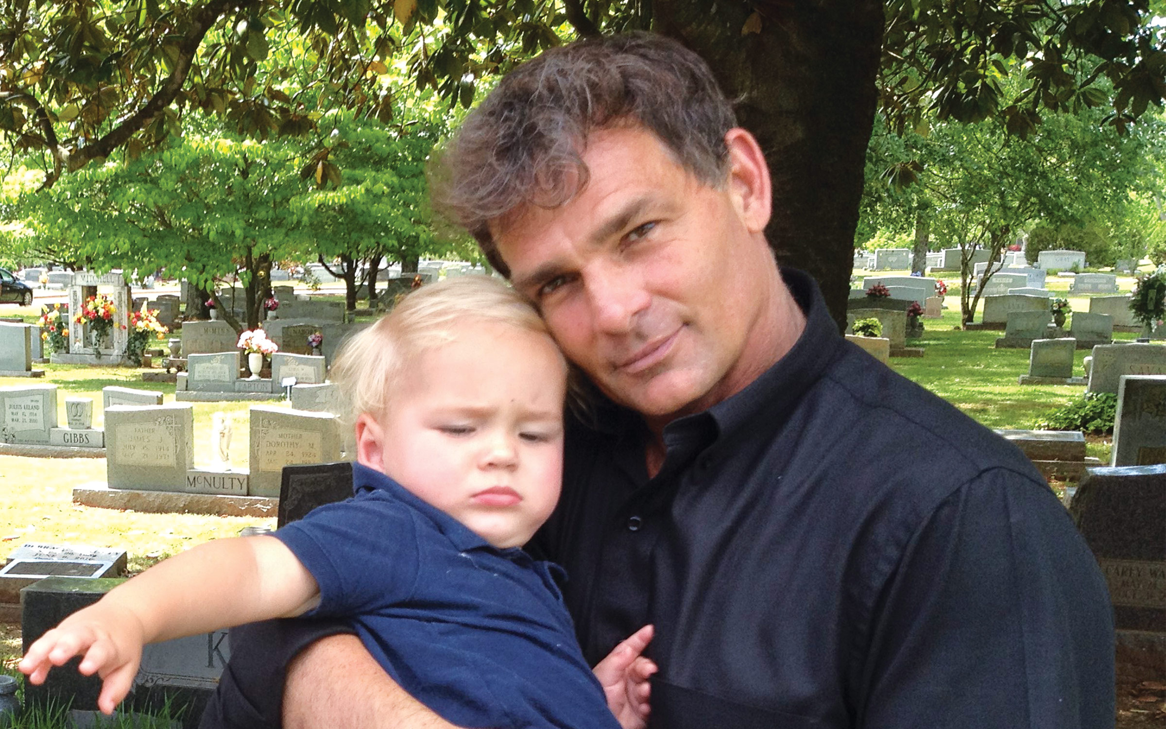 photo of barnes holding baby