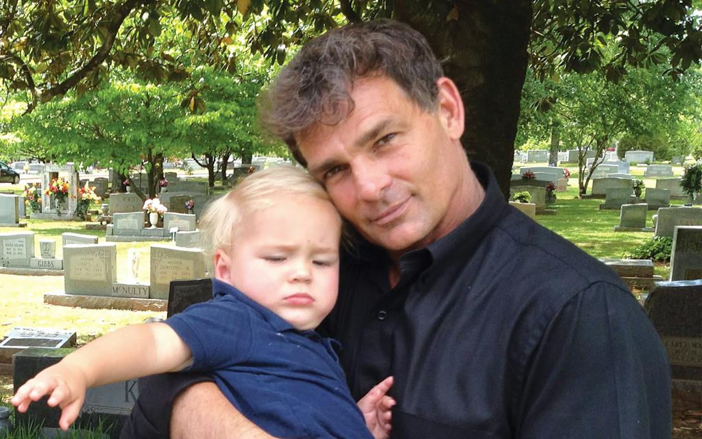 photo of barnes holding baby