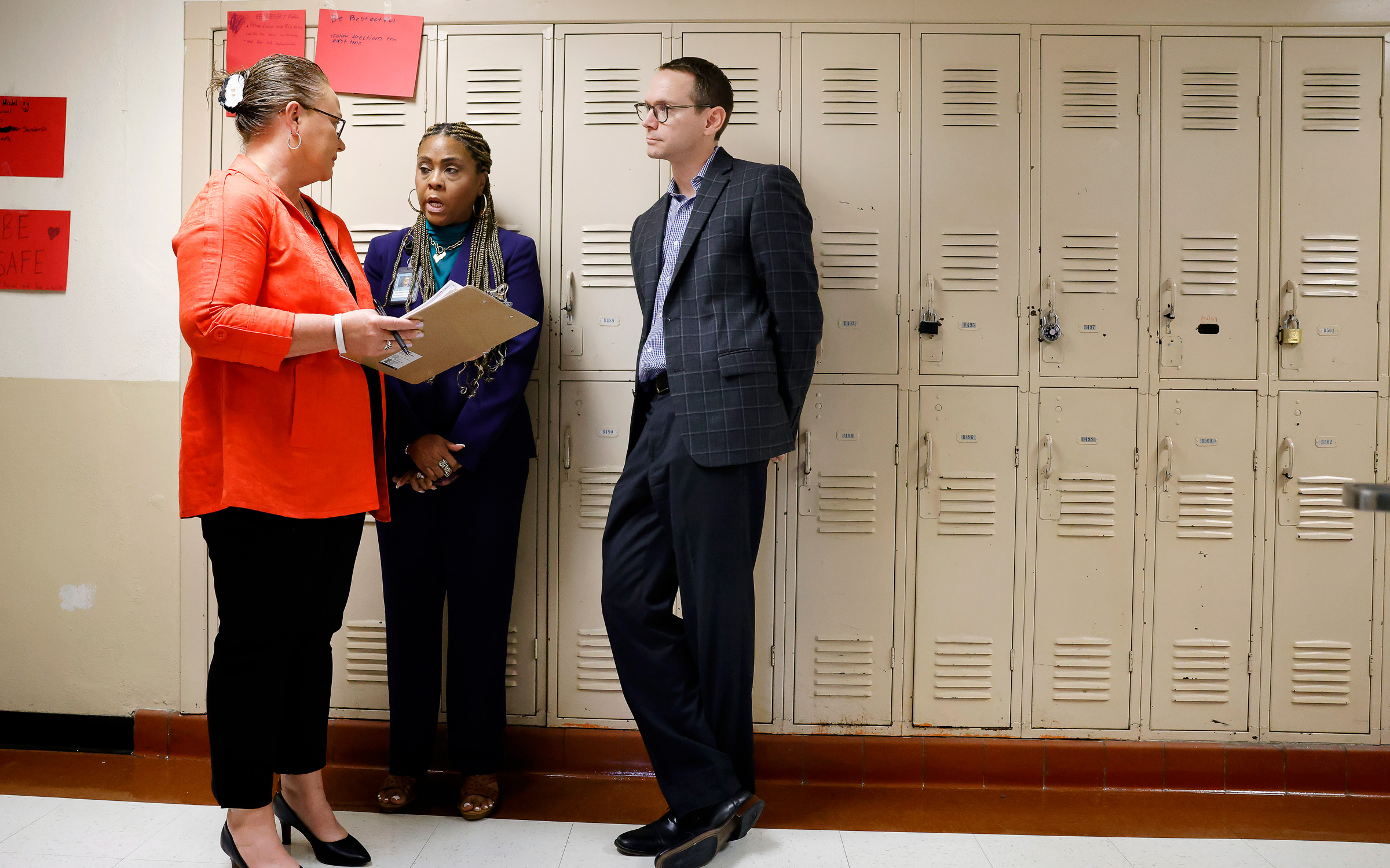 TEA commissioner Mike Morath listens to William James Middle School principal Michelle Guerra (left) and Fort Worth ISD Executive Director of School Leadership Kisha McDonald during a tour of William James Middle School in Fort Worth, on August 28, 2025
