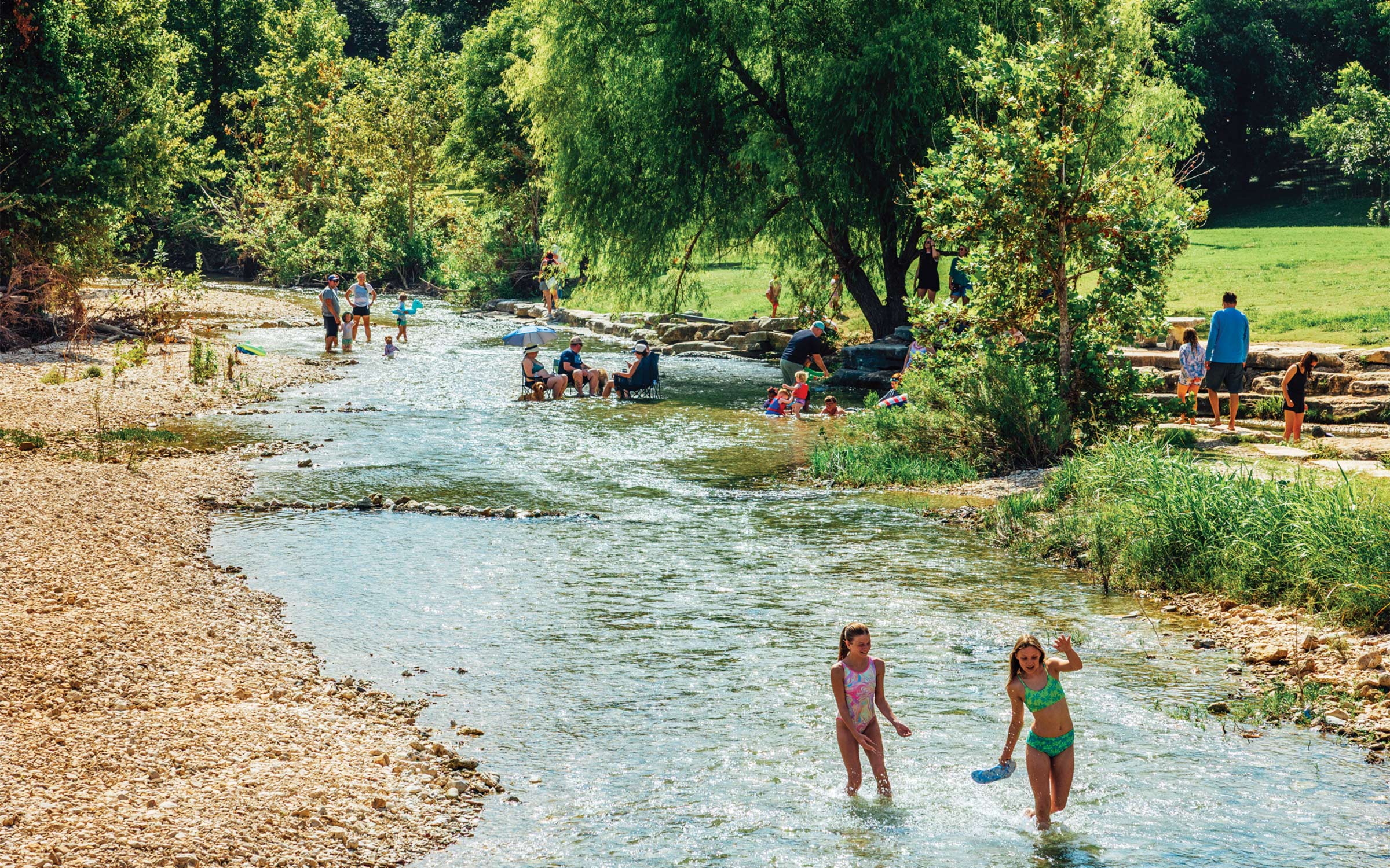 photo of people in creek