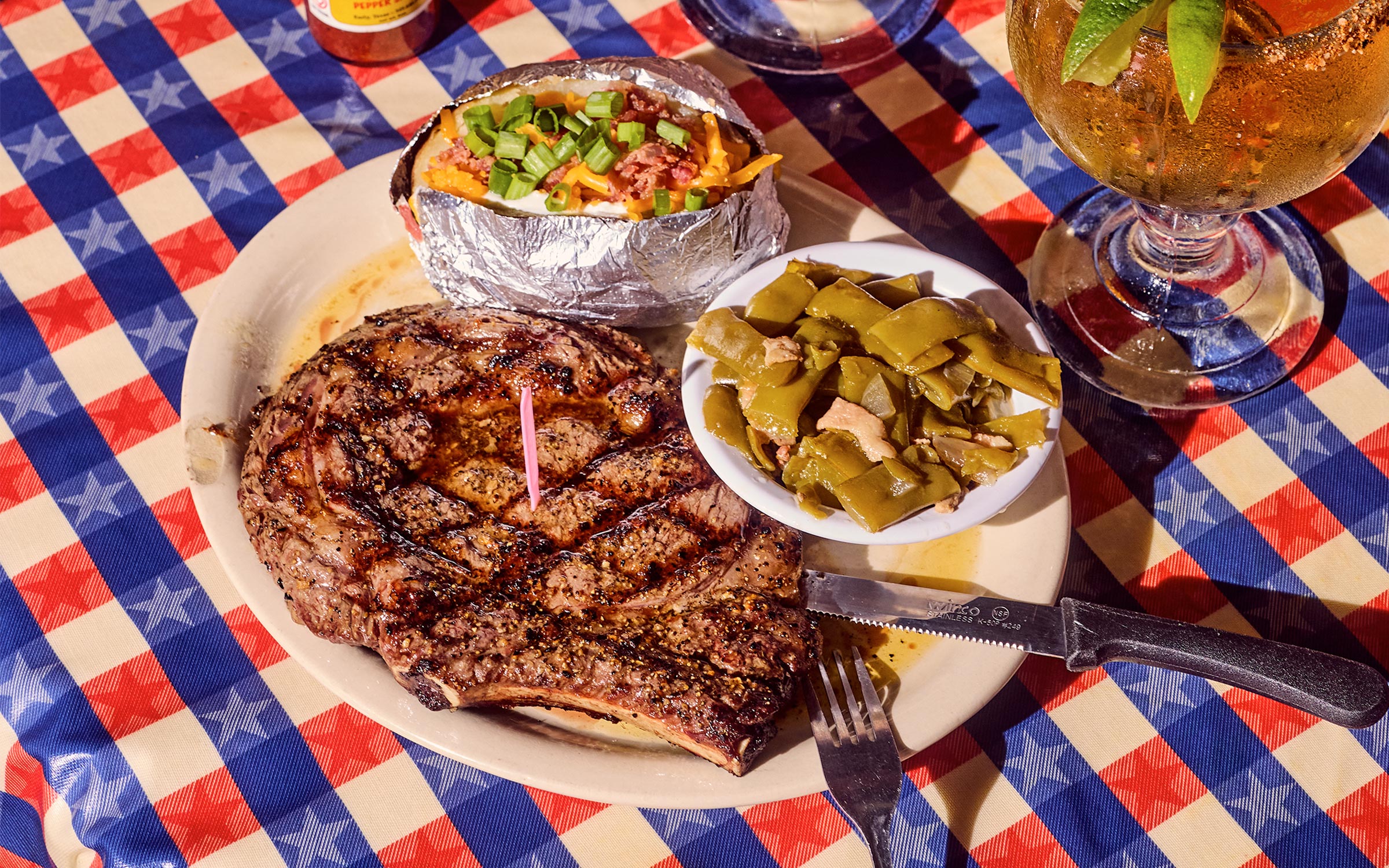 closeup photo of ribeye and sides on plate