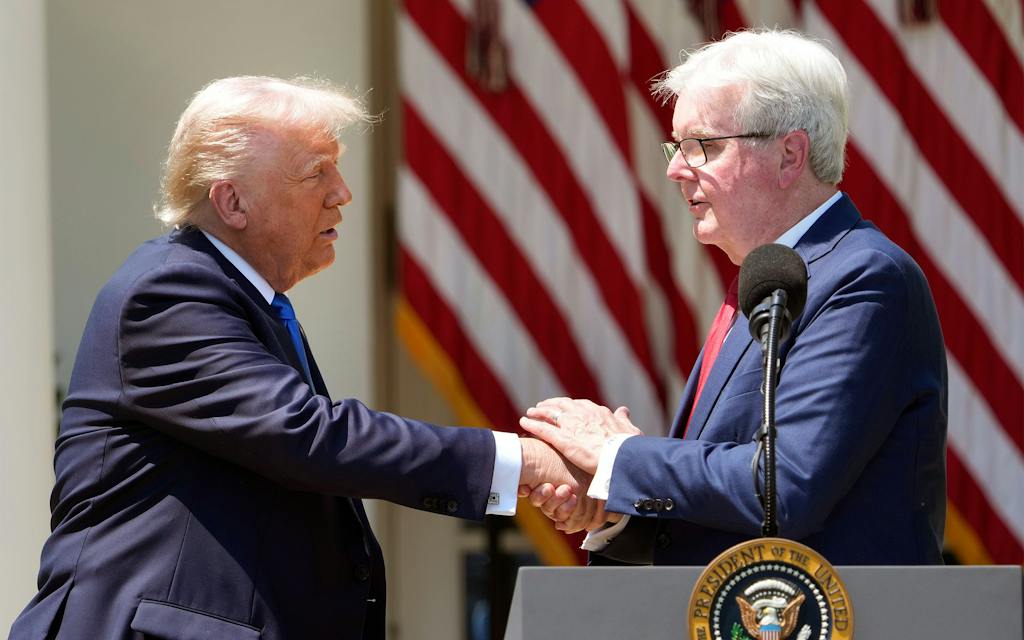 photo of donald trump and dan patrick shaking hands